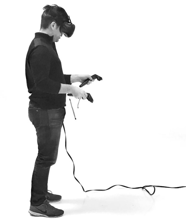 Person using virtual reality headset and controls